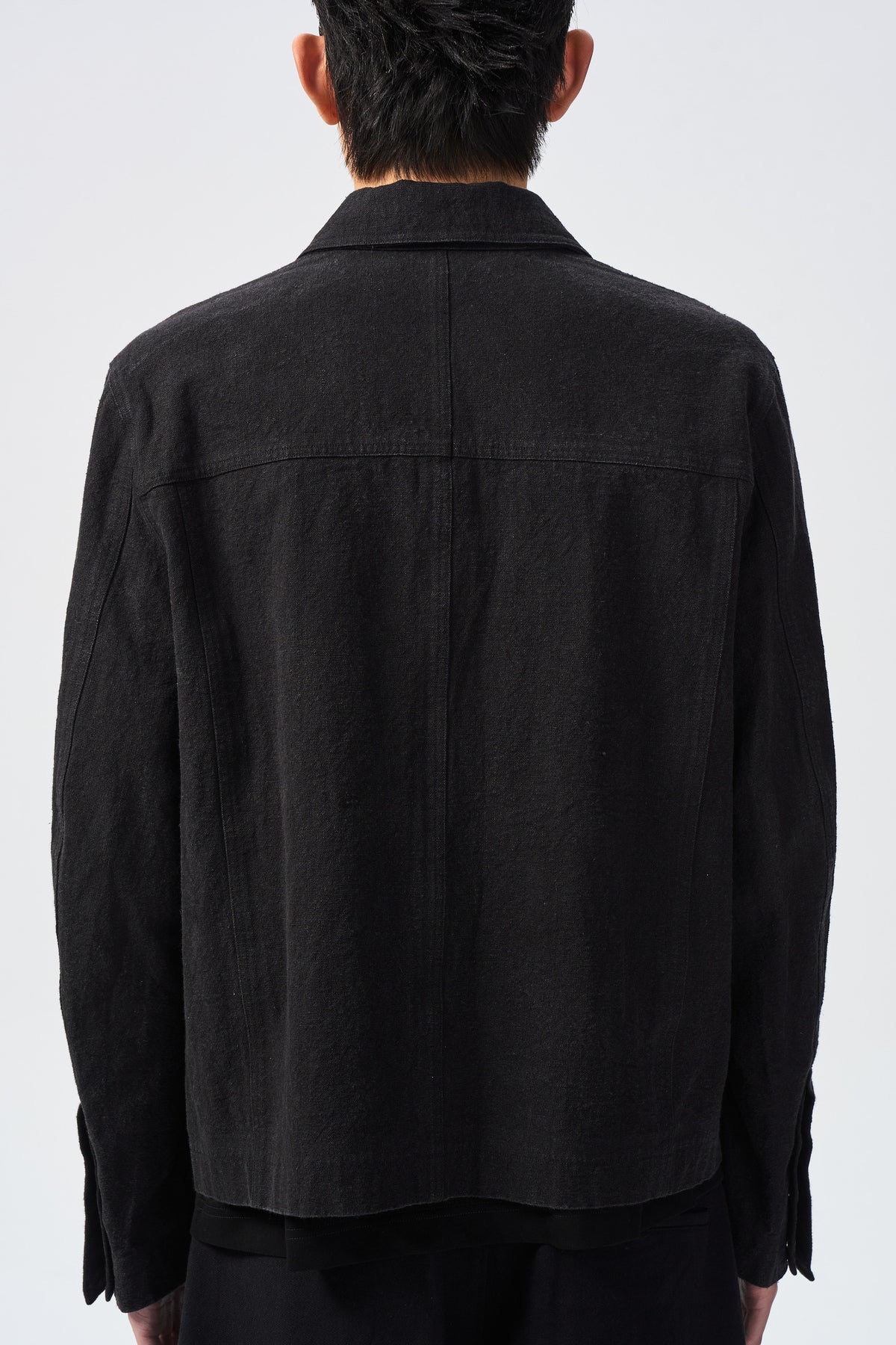 VALL AXIS JACKET — back yoke and hem detail — ATTEMPT AW26