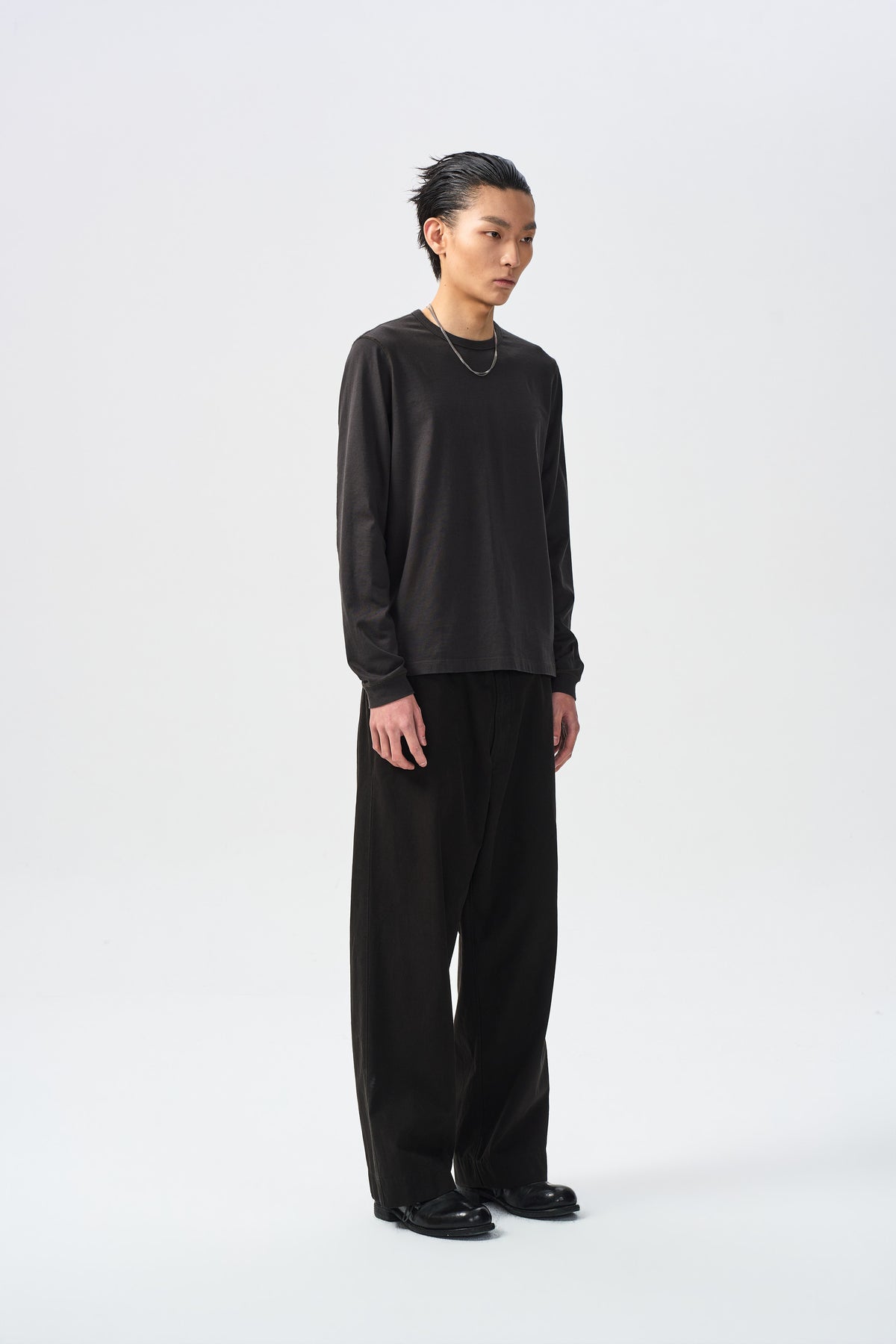 TARN FLAT TROUSERS — front three-quarter full view — ATTEMPT AW26